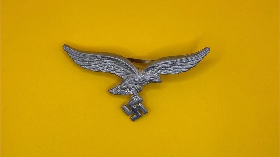 WWII German Luftwaffe Officers Breast Eagle: The Luftwaffe breast eagle was officially adopted in 1935, with the second-pattern version introduced in the late 1930s and worn on the right breast of most Luftwaffe uniforms throughout World War II.