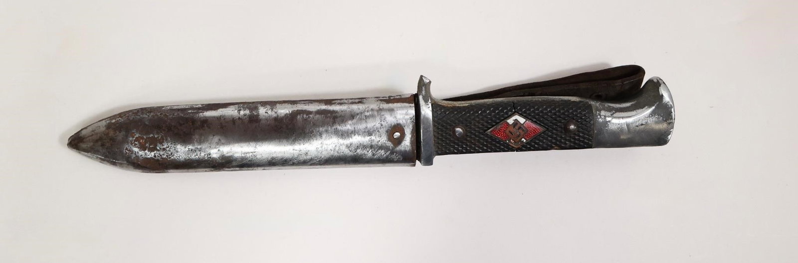 Early HJ Knife: Only one available. Early initial-production HJ knife with a solid steel base and mostly worn nickel plating. Features early closely checkered Bakelite grip plates secured by worn nickel rivets with