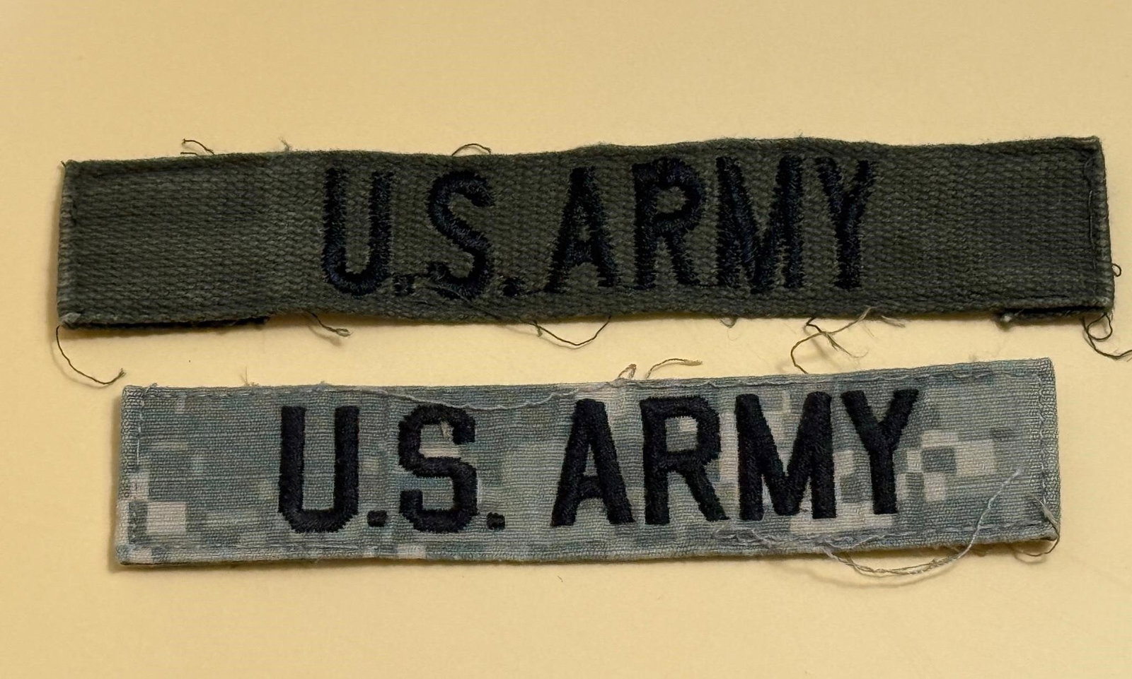 U.S. Army Name Tapes: U.S. Army name tapes, which are fabric strips worn on military uniforms for identification purposes. Dimensions; 5in x 1in, 5.5in x 1in