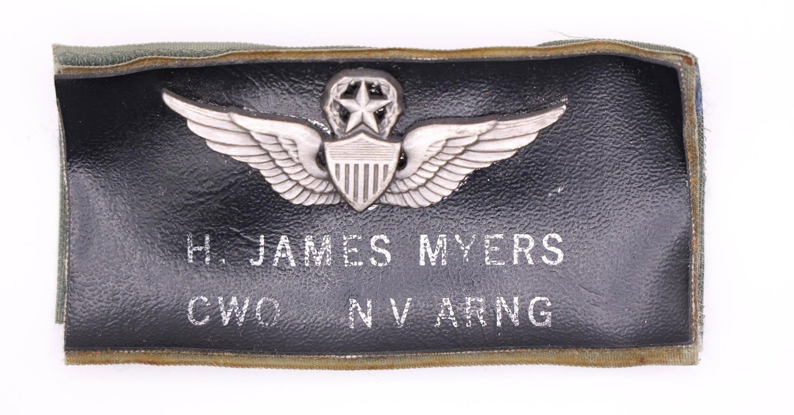 US Army Master Aviator Badge: The image shows a U.S. Army Master Aviator Badge mounted on a leather name tag for H. James Myers. The badge is awarded to soldiers who have demonstrated extensive proficiency and skill in aviation