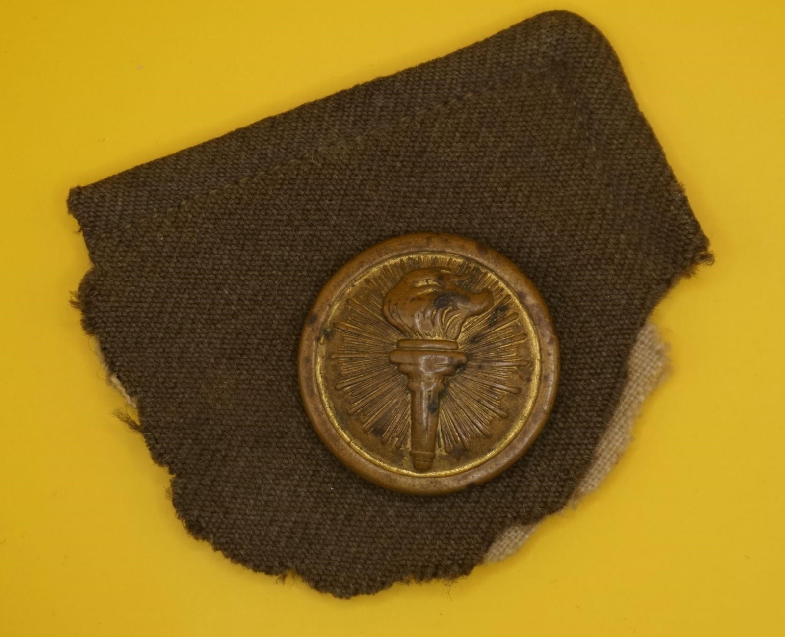 WWII Vintage US Army ROTC Collar Pin: This is a vintage US Army Reserve Officer Training Corps (ROTC) enlisted man's branch of service collar badge or pin, featuring the "torch of knowledge" insignia. The insignia depicts a flaming