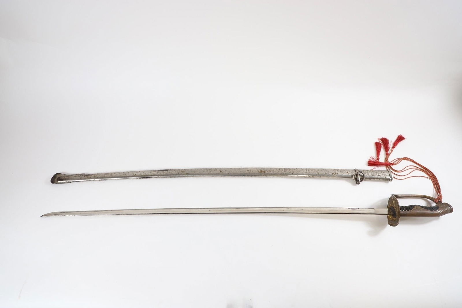 WWII Japanese Officer Parade Sword Colonel Tassel: In World War II, a Japanese officer's parade sword (typically the Kyu Gunto style) featuring a Colonel's tassel (sword knot) serves as a specific indicator of field grade rank. Sword and Tassel