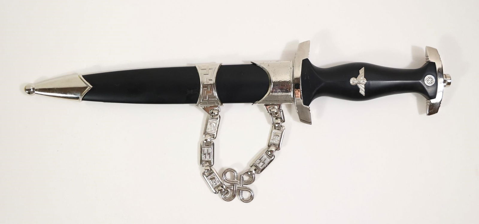 1933 SS Officers Replica Dagger: This 13½" overall replica of a 1933 SS Officers dagger features the SS motto "Meine Ehre Heisst Treue" engraved on an 8½" high-carbon steel blade. It has a black composite handle with