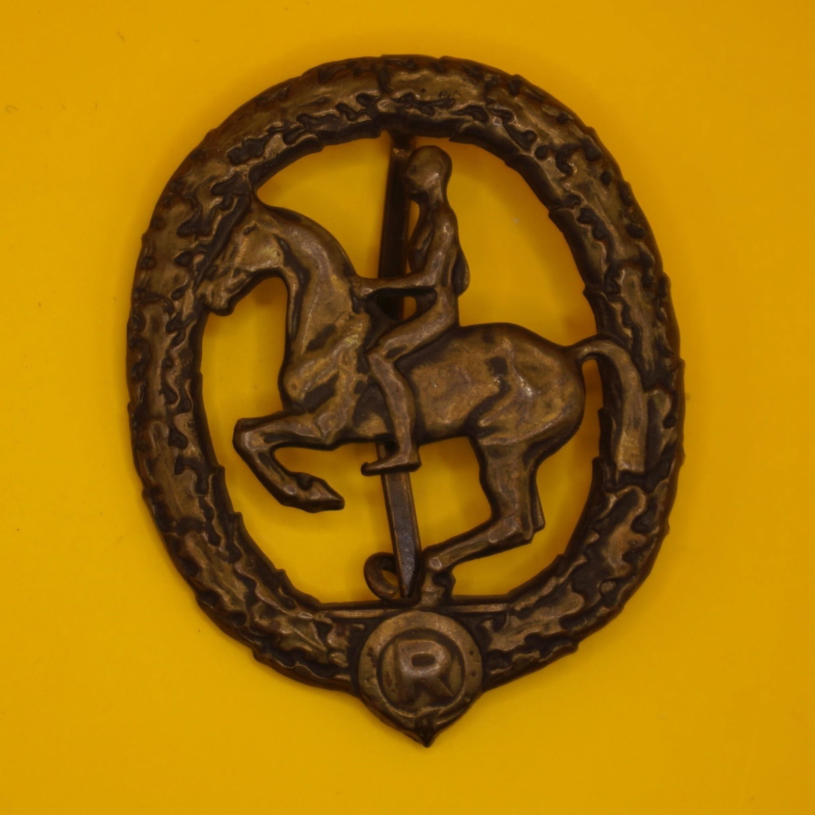 German Bronze Badge - L. Chr. Lauer: Alloy metal badge with bronze-colored finish, maker marked "L. Chr. Lauer Nürnberg-Berlin" and "Gesetzlich Geschützt" on reverse. Good condition with attractive age patina; hinge, pin, and catch