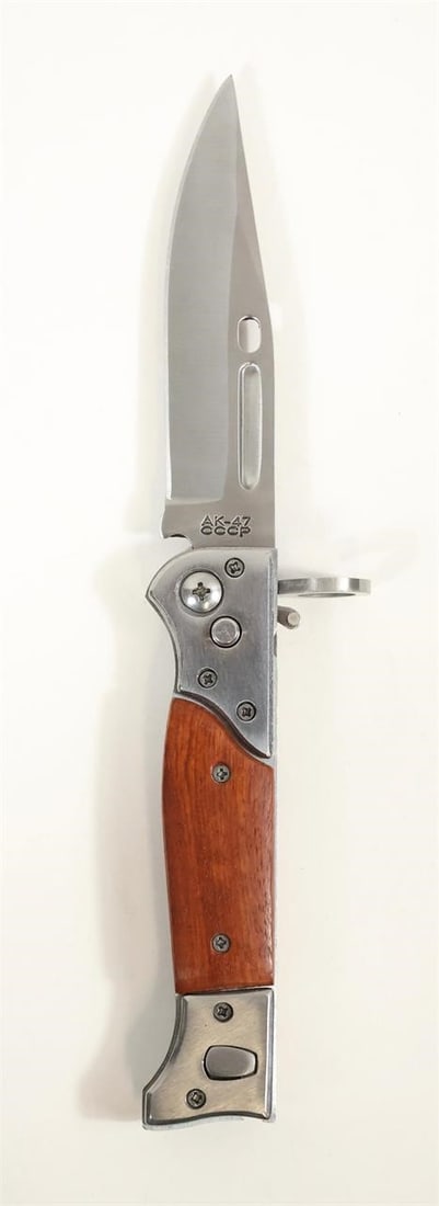 AK-47 CCCP Bayonet Pocket Knife: AK-47 CCCP Bayonet folding knife with stainless steel blade and ergonomic handle. Measures approx. 8.5" open and 4.75" closed. Lightweight and smooth action. In good condition with wear consistent
