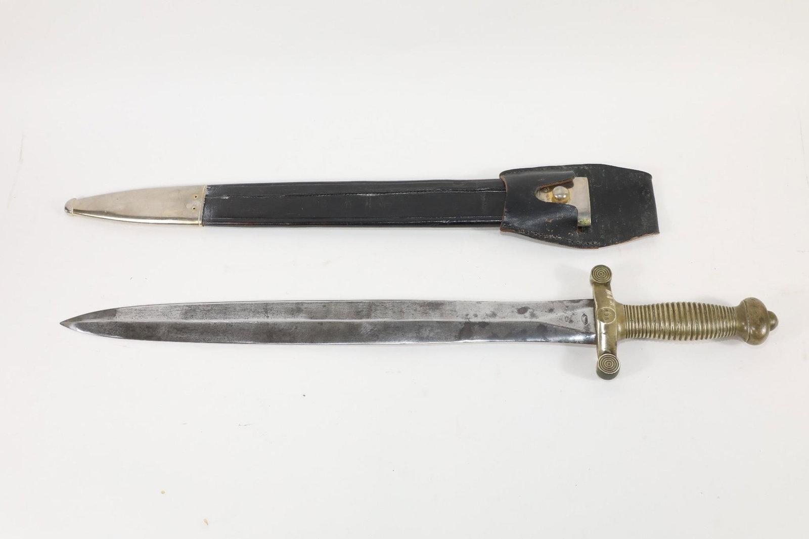 French Model 1831 Foot Artillery Sword: The sword has a blade of approximately 19 1/4 inches, with an overall length of approximately 25 inches. The blade bears an indistinct mark on this ricasso (almost certainly the mark of the Director,