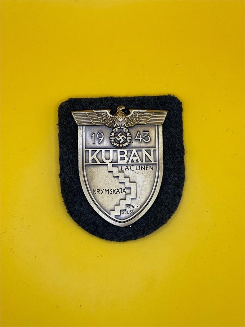 Kuban Shield - Heer Panzer Troops: Awarded to German Heer troops who fought at the Kuban bridgehead (Feb-Oct 1943), the Kuban Shield features a German eagle clutching a laurel-wreathed swastika above "KUBAN" and a map of the