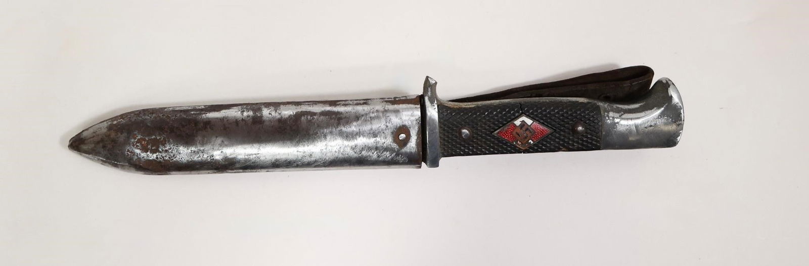 Early HJ Knife: Only one available. Early initial-production HJ knife with a solid steel base and mostly worn nickel plating. Features early closely checkered Bakelite grip plates secured by worn nickel rivets with