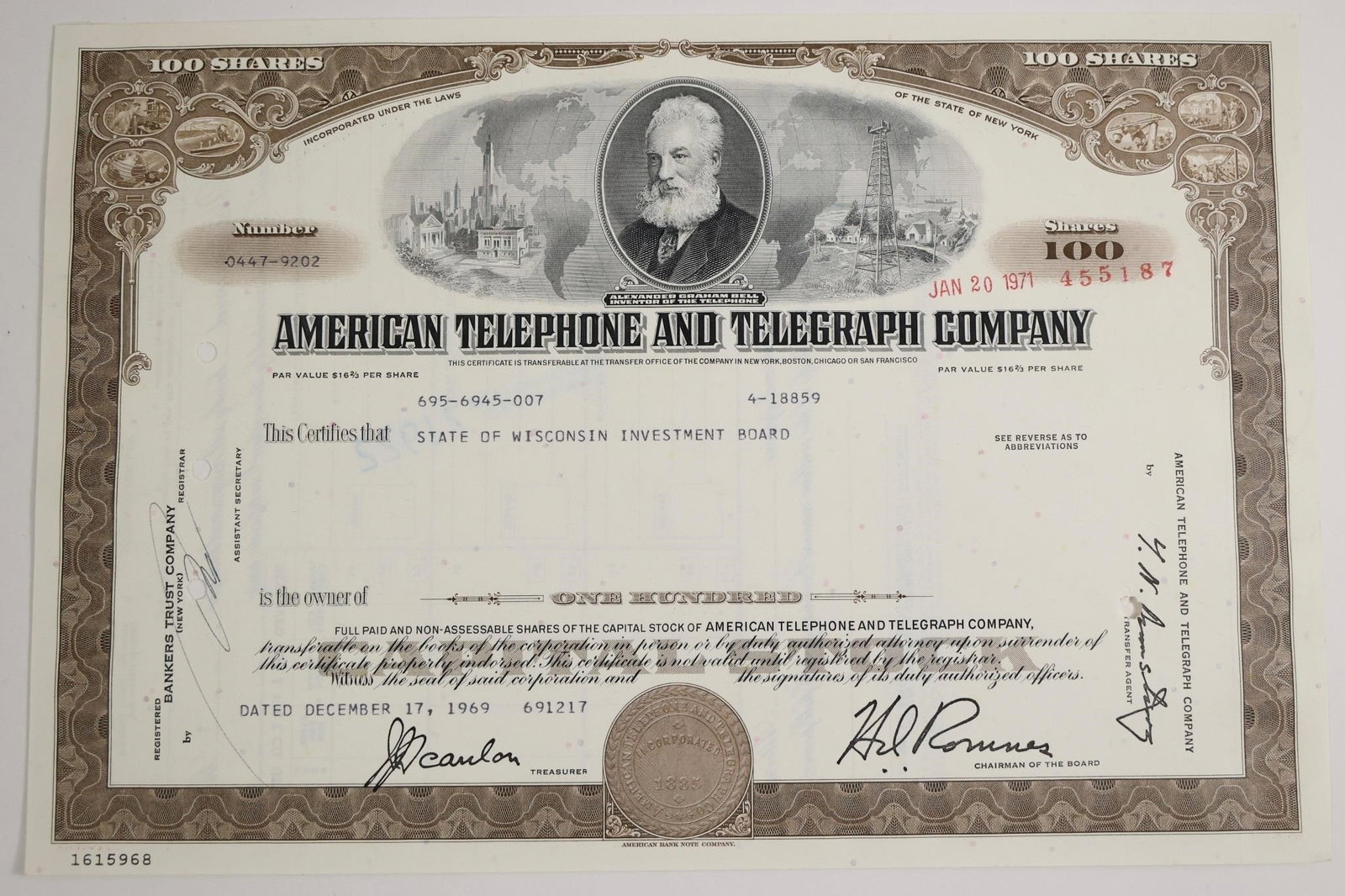 AT&T 100-Share Stock Certificate: Vintage American Telephone and Telegraph Company stock certificate for 100 shares.