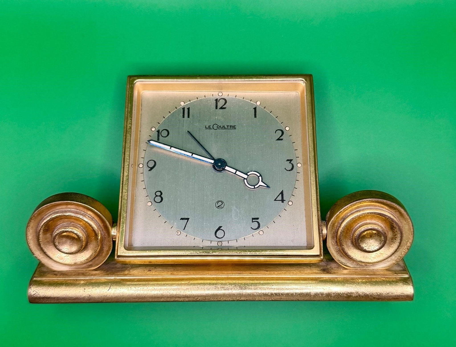 Jaeger-LeCoulre Desk Alarm Clock: Antique Collectable gold tone alarm clock.Jeager-LeCoultre is a renowned Swiss luxury watch and clock manufacturer.Working ConditionDimensions: 5x4x2