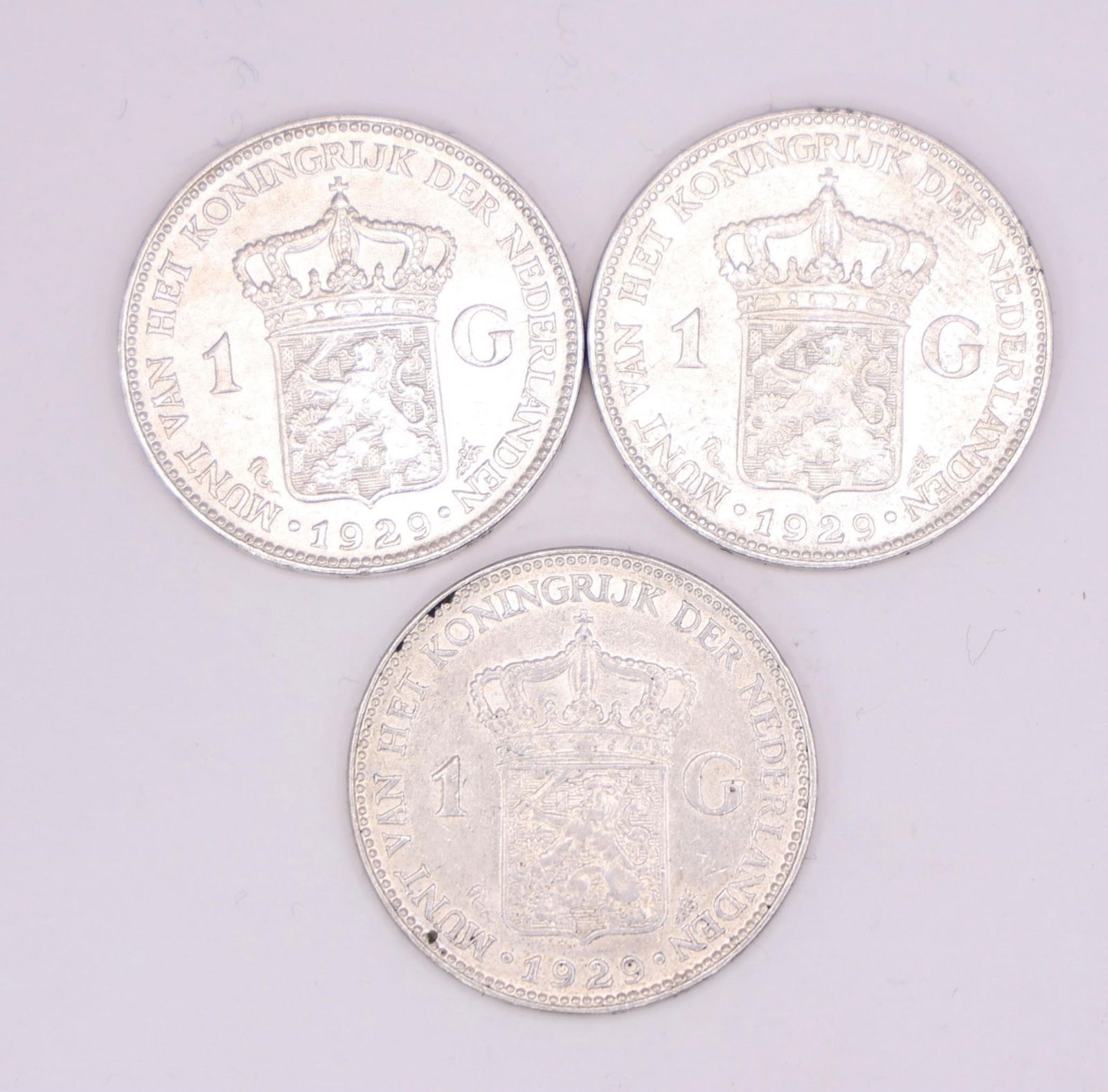 1929 Netherlands Queen Wilhelmina Silver Gulden: Three 1929 Netherlands silver 1 Gulden coin featuring Queen Wilhelmina, struck in .720 silver.