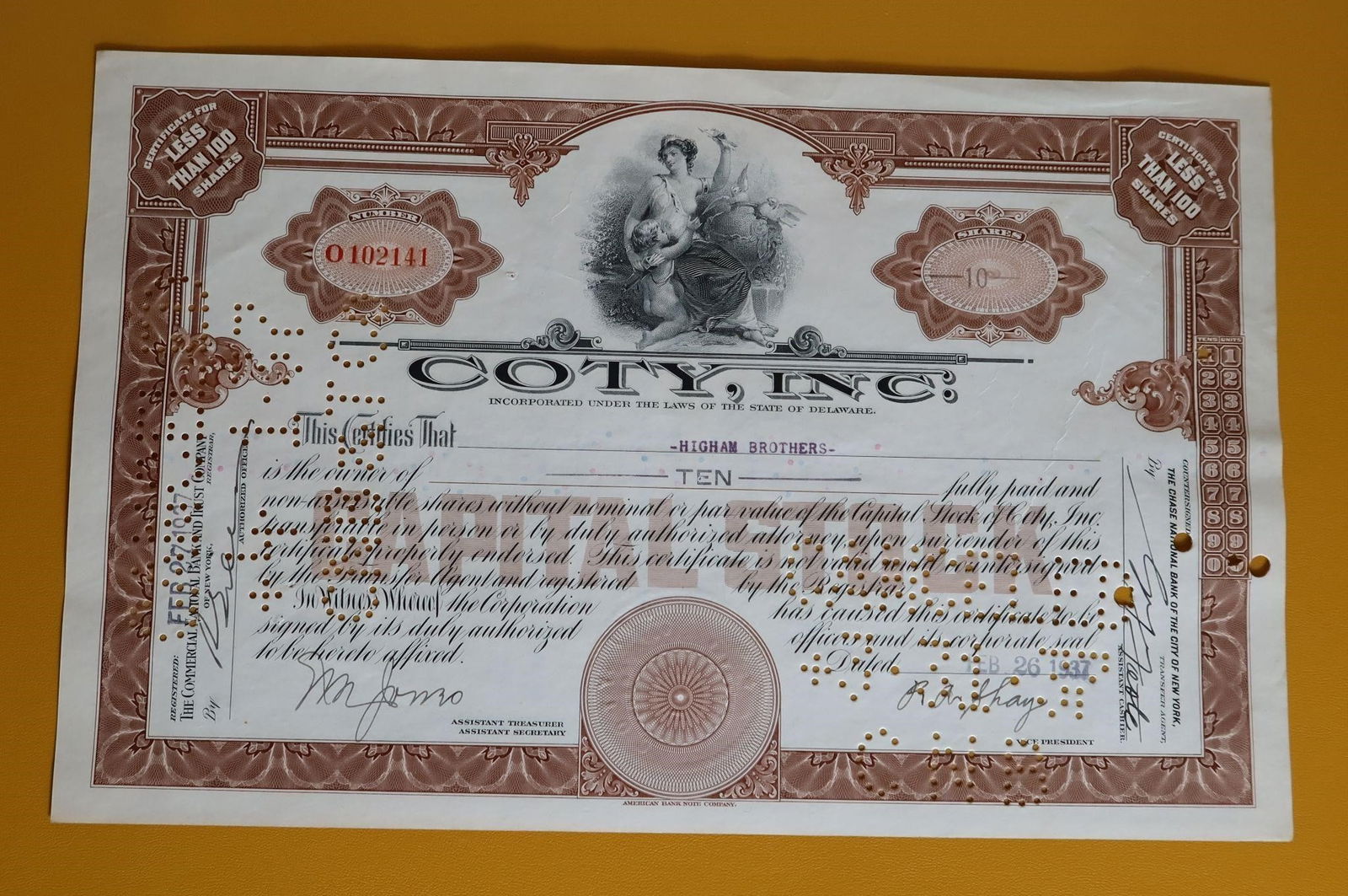 1930s Coty Inc. Stock Certificate - Higham Bros: An original Coty, Inc. stock certificate from the 1930s issued to "Higham Brothers". Key details of this collectible item include: It is a certificate for less than 100 shares (specifically ten