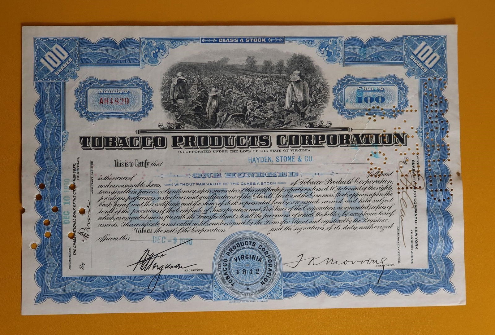 Tobacco Products Corporation Stock Certificate: A Tobacco Products Corporation stock certificate, a vintage financial document now primarily valued as a collectible. It represents 100 shares of Class A Stock in the corporation. The certificate is d