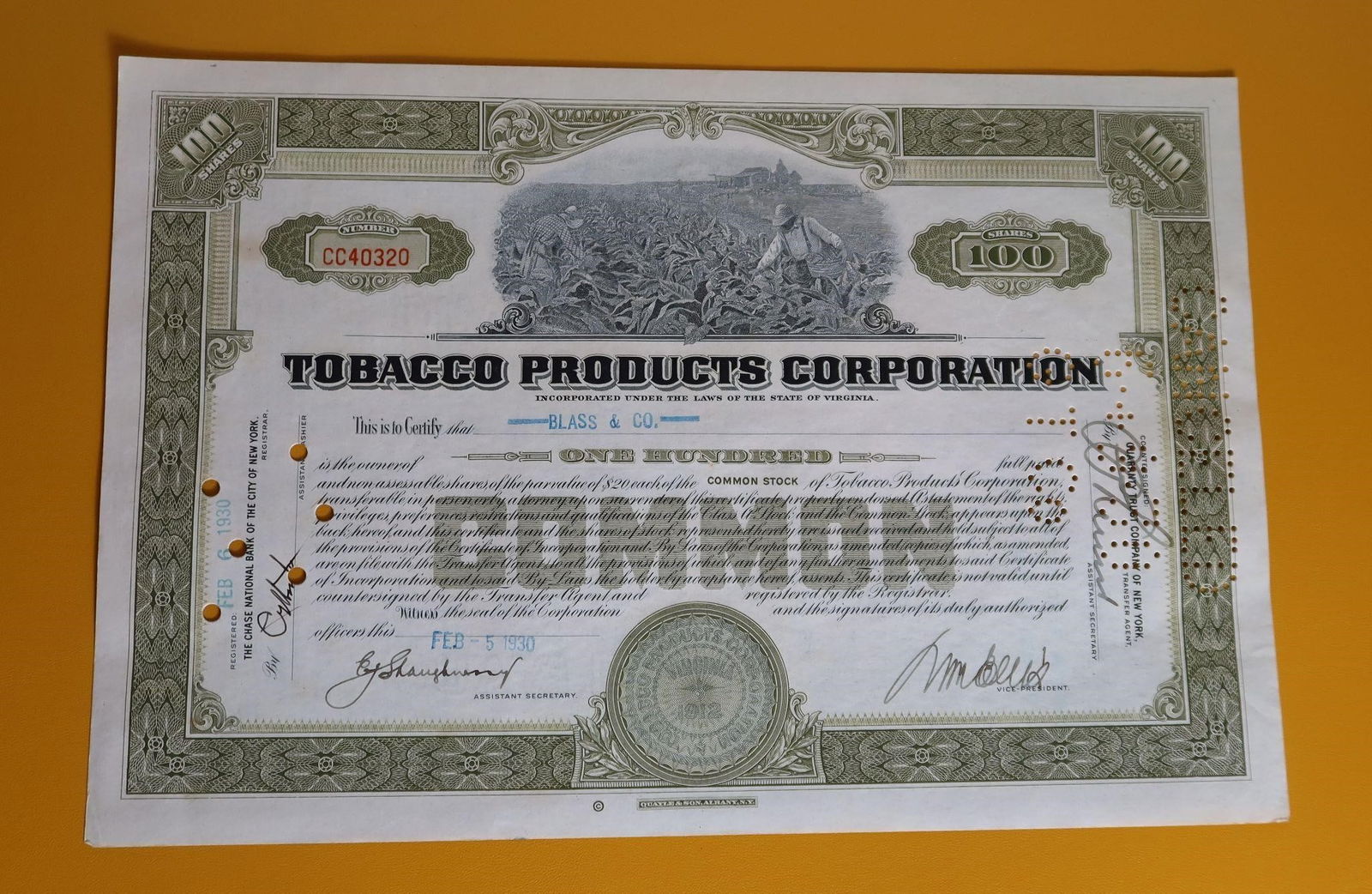Canceled Tobacco Products Corp. Stock Certificate: A cancelled Tobacco Products Corporation stock certificate for one hundred shares, issued on February 5, 1930. The company was founded in 1912 by George Whelan as a holding company for United Cigar St