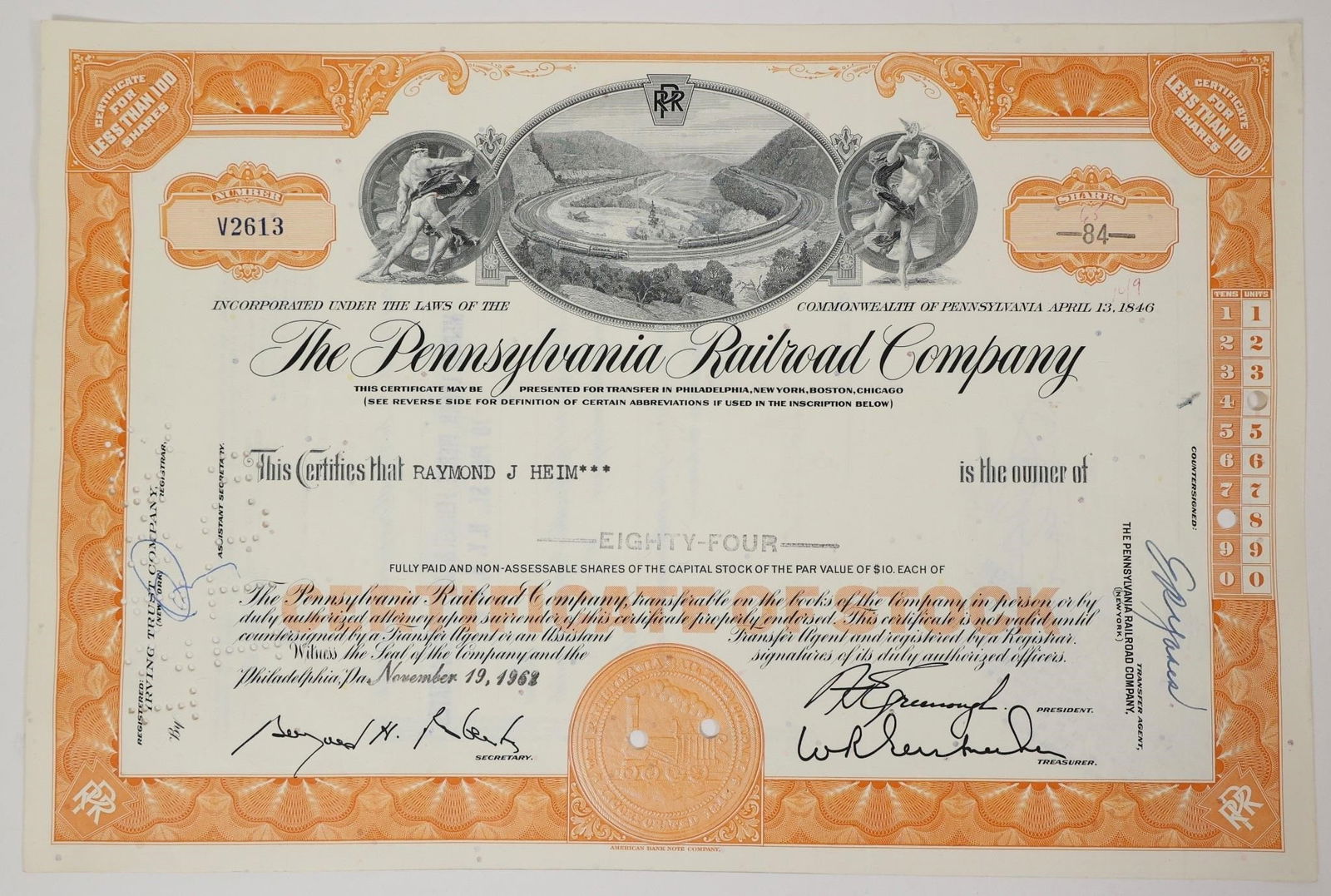 Pennsylvania Railroad Stock Certificate 1968: This is an orange Pennsylvania Railroad Company stock certificate issued in 1968.