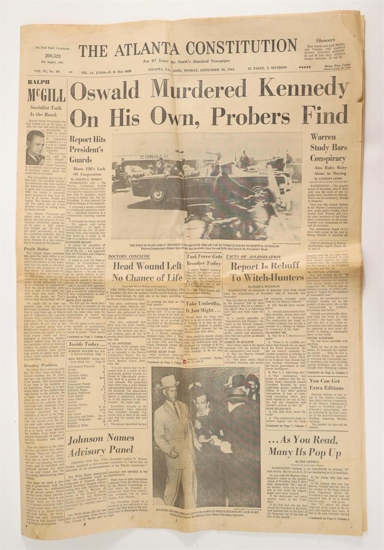 Atlanta Constitution Newspaper 1963: Original edition of The Atlanta Constitution newspaper, featuring headlines about the Warren Commission's initial findings on the John F. Kennedy assassination and the murder of Lee Harvey Oswald by J