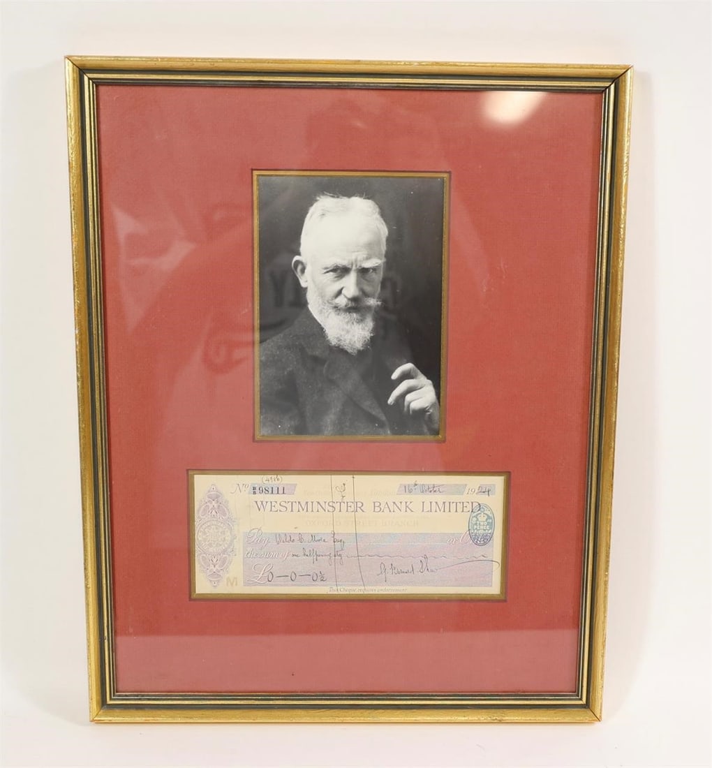 George Bernard Shaw Framed Collectible: This item is a framed collectible display featuring a portrait and a signed bank check from the Irish playwright George Bernard Shaw.