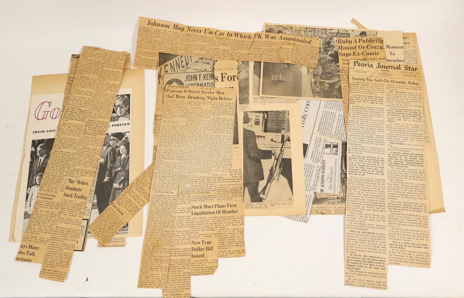 JFK Assassination Newspaper Clippings Lot (1963): Collection of vintage newspaper clippings and magazine pages related to the assassination of President John F. Kennedy in 1963. Includes articles discussing the shooting in Dallas, Lee Harvey Oswald,