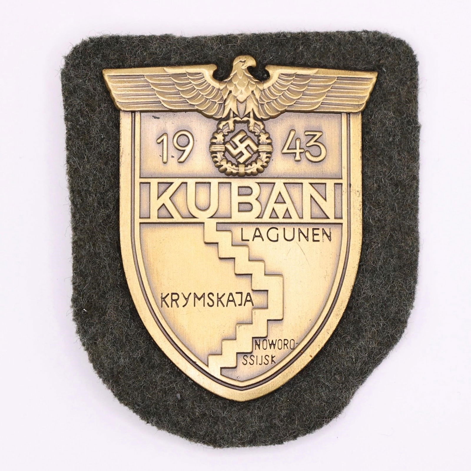 Kuban Shield - Heer Panzer Troops: Awarded to German Heer troops who fought at the Kuban bridgehead (Feb-Oct 1943), the Kuban Shield features a German eagle clutching a laurel-wreathed swastika above "KUBAN" and a map of the
