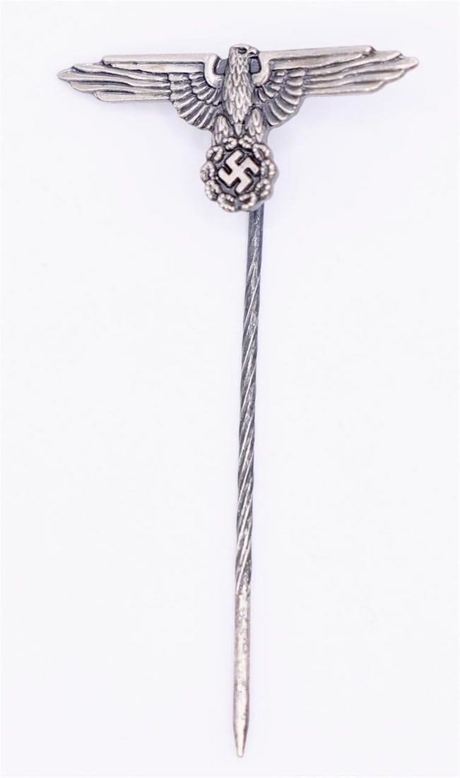 WWII German NSRKB Membership Stickpin: A very fine example of the NSRKB membership badge in stickpin form. This badge is maker marked to the reverse, under the pin with a "6". Much of the original silver wash remains. Good condition.