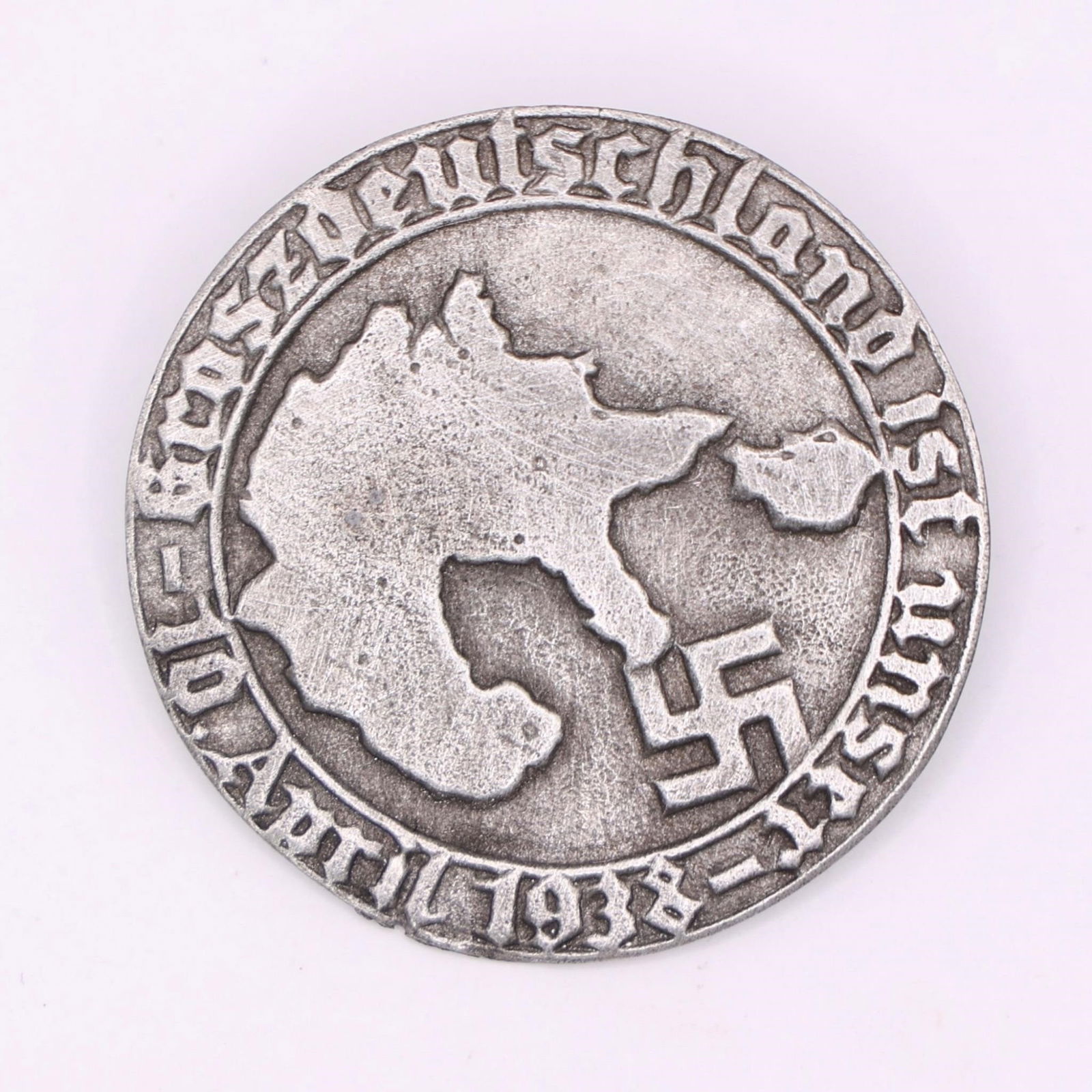 1938 German Anschluss Commemorative Medal: German commemorative medal issued to mark the Anschluss, the annexation of Austria into Nazi Germany on April 10, 1938. Historical Third Reich-era collectible featuring period symbolism associated