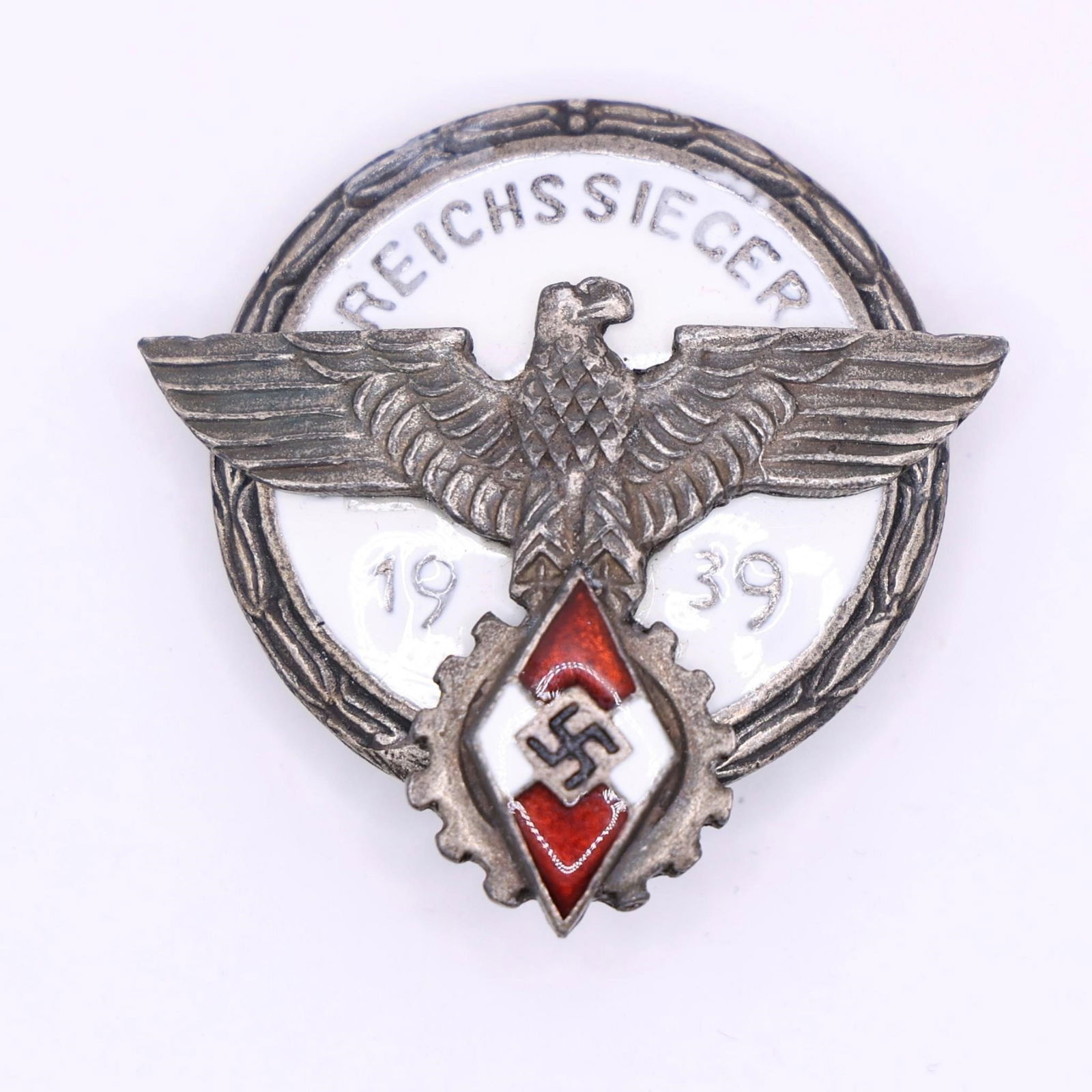 WWII German Kreissieger 1939 Badge: This Kreissieger 1939 badge is a bronze-grade award presented to district-level winners of the National Trade Competition (Reichsberufswettkampf) in Nazi Germany.