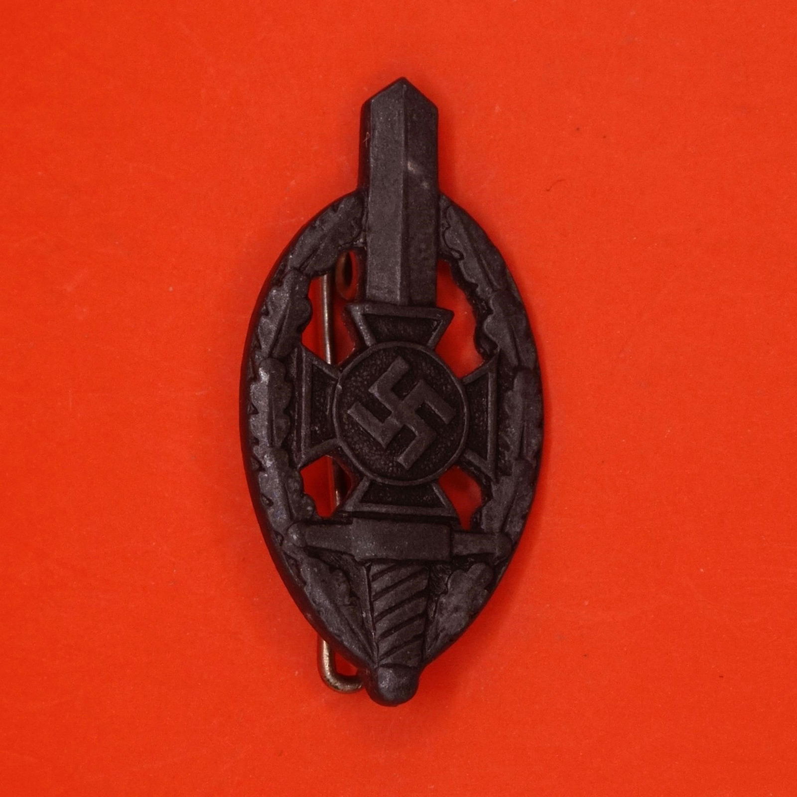 Germany III Reich NSKOV Badge: German Third Reich NSKOV (National Socialist War Victim's Care) badge, metal construction with pin back, typical period design, good condition.