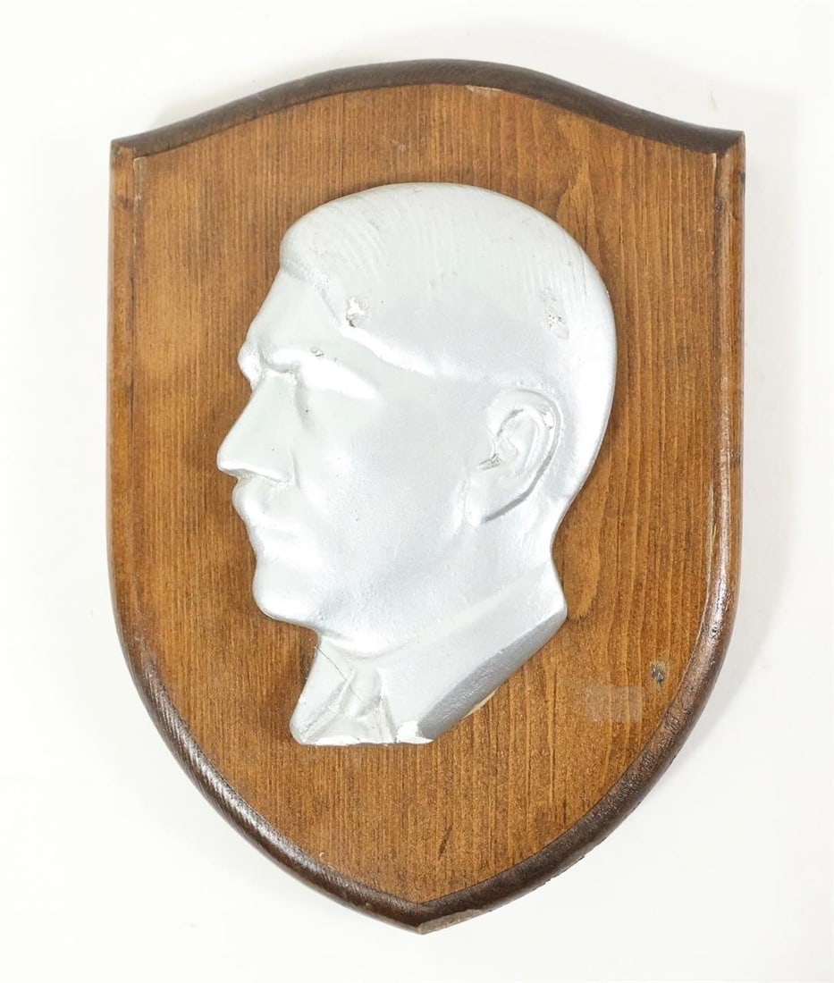 WWII GERMAN REICH ADOLF HITLER WOOD WALL PLAQUE: WWII German Reich Adolf Hitler wood wall plaque, featuring a period-style carved or relief portrait mounted on a wooden backing. A historical display piece representative of Third Reich-era