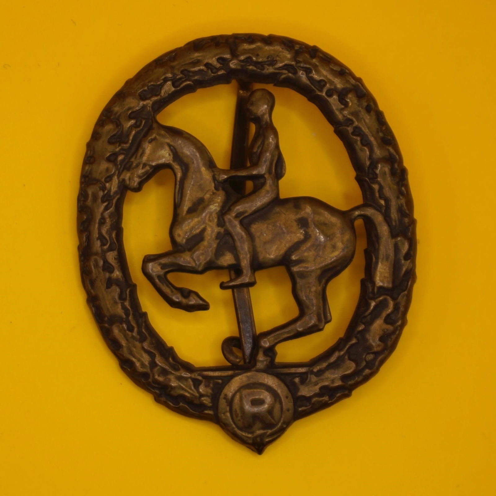 German Bronze Badge - L. Chr. Lauer: Alloy metal badge with bronze-colored finish, maker marked "L. Chr. Lauer Nürnberg-Berlin" and "Gesetzlich Geschützt" on reverse. Good condition with attractive age patina; hinge, pin, and catch