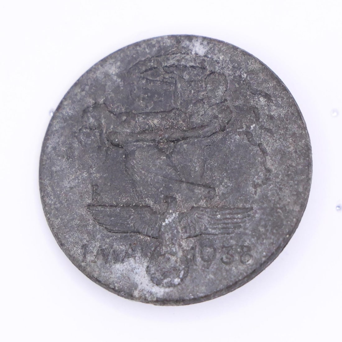 WWII GERMAN 1938 MAY DAY TINNIE: WWII GERMAN 1938 MAY DAY TINNIE. GOOD PIN BACK WITH HOOK CATCH.