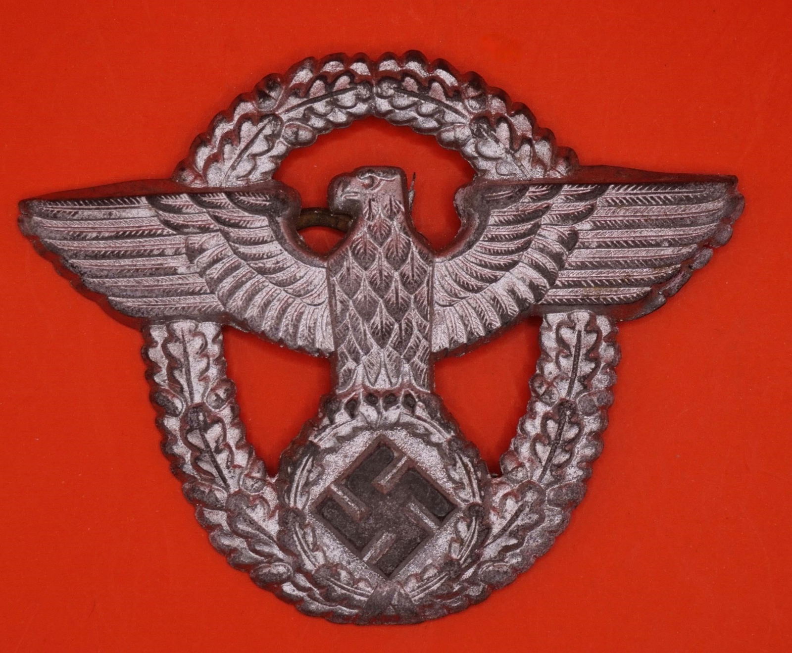 German Police Cap Eagle Badge - Friedrich Linden: Original German police cap eagle badge produced by Friedrich Linden, Lüdenscheid. Period-manufactured example showing honest age-related wear, suitable for a WWII-era police or insignia collection.