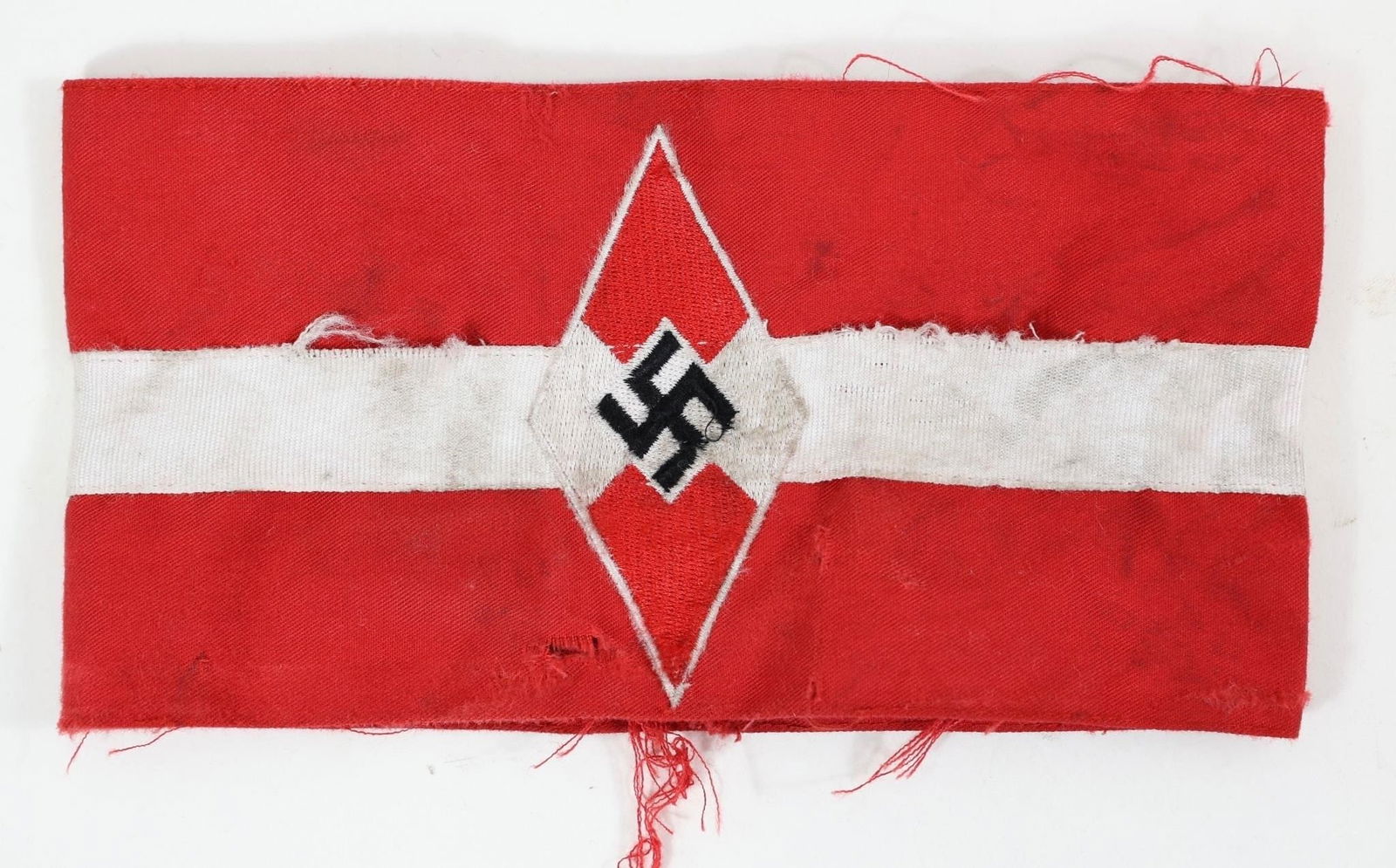 WWII German Hitler Youth Armband: Vintage World War II-era German Hitler Youth armband with embroidered emblem, showing wear from use.