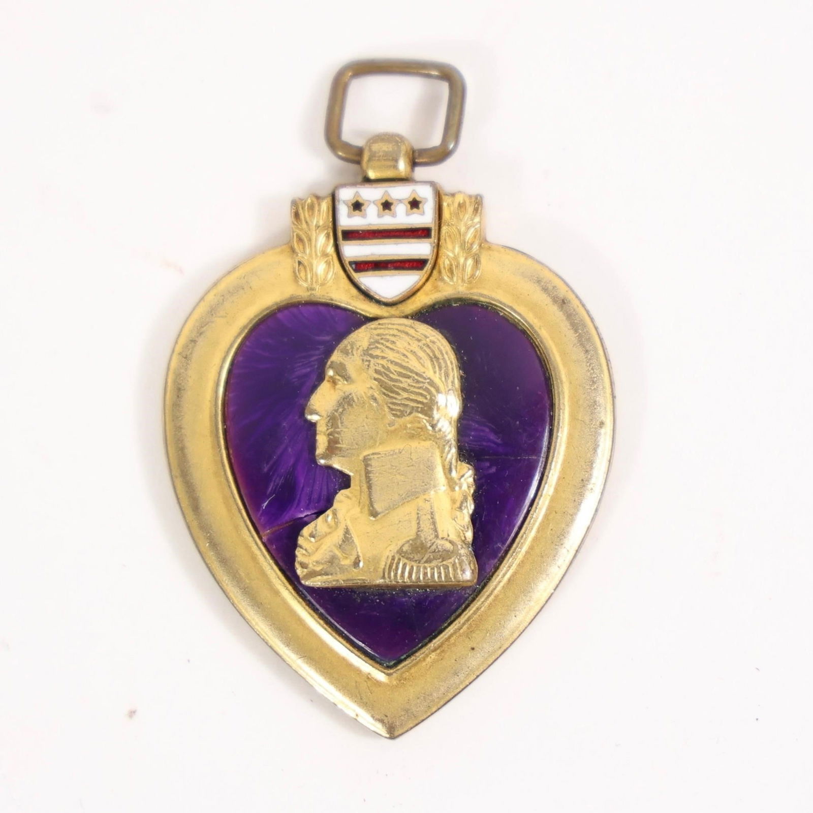Vintage US Military Purple Heart Medal: This item is a Purple Heart medal, a United States military decoration established by George Washington in 1782.