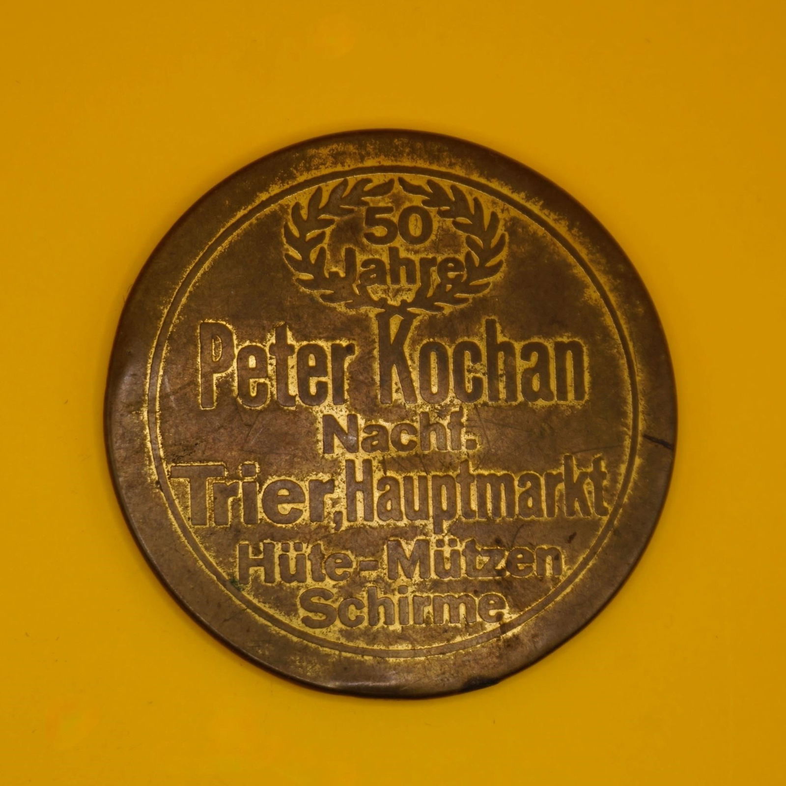 Peter Kochan 50th Anniversary Commemorative Medal: Commemorative token or medal celebrating the 50th anniversary of Peter Kochan, a business located at Trier Hauptmarkt. Good condition.