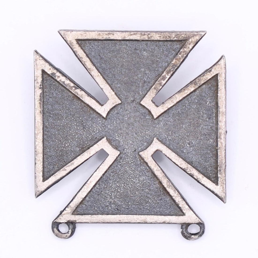 WWII US Army Marksman Qualification Badge: This is a US Army Marksman Qualification Badge. The badge is a white metal (silver, nickel, or rhodium) cross pattée, 1 inch in height. It is awarded to personnel upon successful completion of a weap