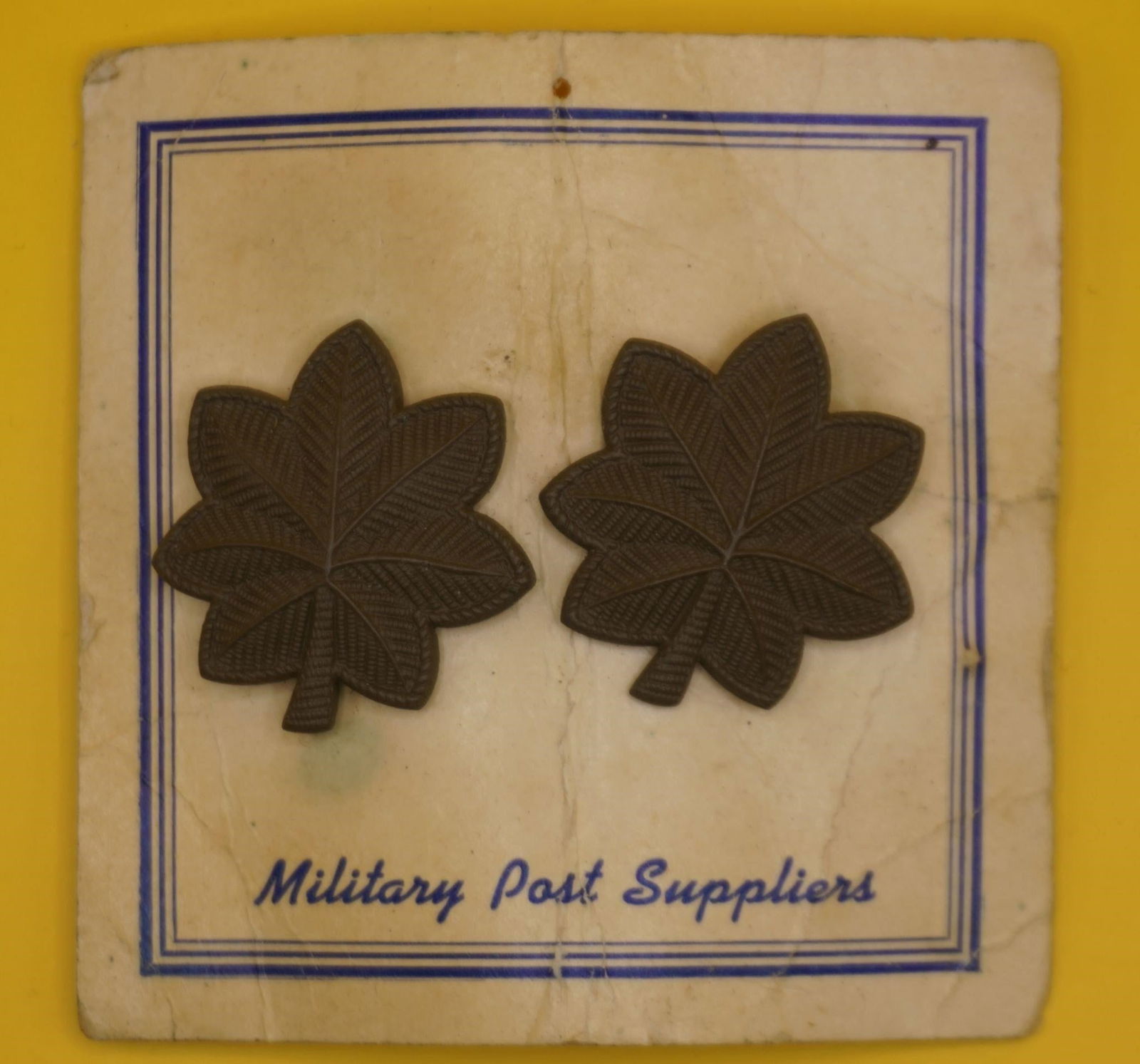 WWII US Army Major O4 Subdued Rank Insignia Badges: This is a pair of U.S. Army Major (O-4) subdued rank insignia pin-on badges. The insignia are designed to be less conspicuous for use on combat and utility uniforms. They are made of durable solid met