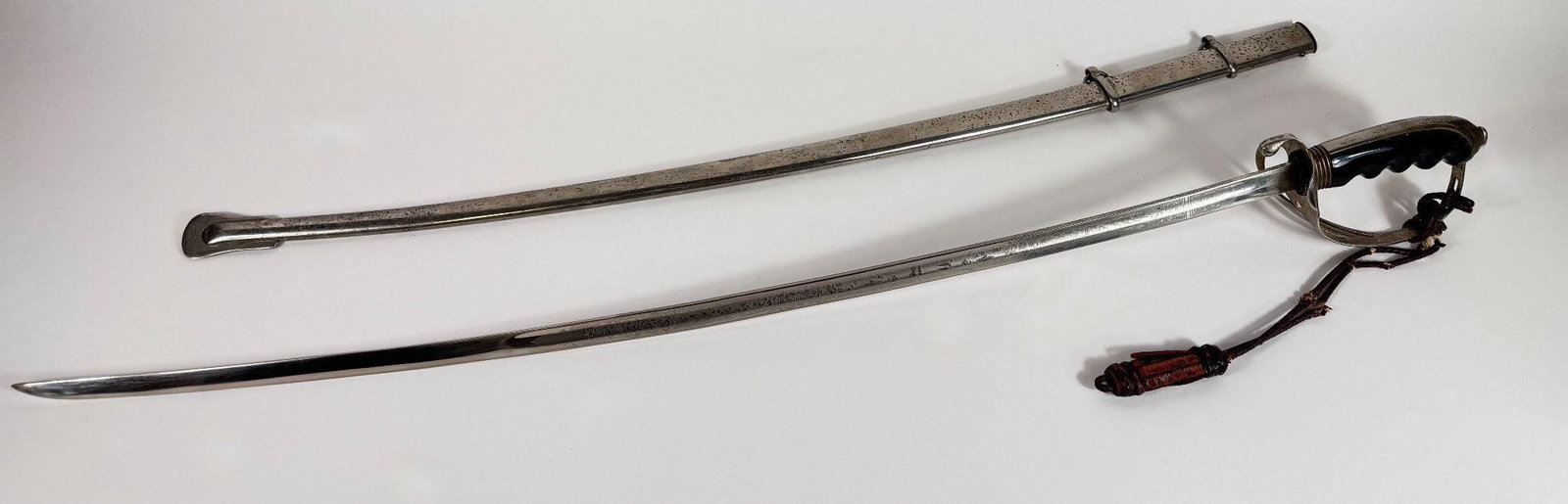 WWI US Army Model 1902 Officer's Saber: U.S. Army Model 1902 Officer's Saber This type of sword was primarily intended for dress and ceremonial use, representing a shift from earlier combat-oriented designs. Key FeaturesHilt: The hilt is a