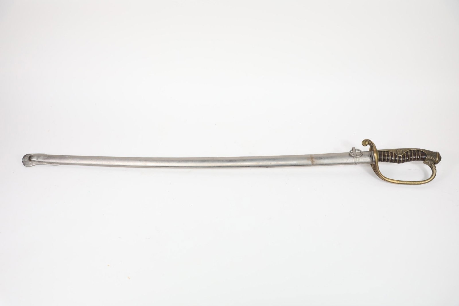 WWII JAPANESE OFFICER'S TYPE 19 KYU-GUNTO SABER: World War II-era Japanese Army Officer's Type 19 Kyu-Gunto saber featuring a 30.75" blade and 35.5" overall length. It has a black celluloid grip (missing the brass wire wrap) and a brass