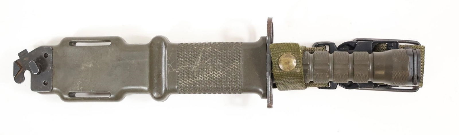 Authentic M9 Bayonet Marked LanCay USA: Authentic M9 bayonet marked LanCay USA, complete with its matching military-style sheath. Features a serrated spine, spear-point blade, and textured grip. The sheath includes the integrated