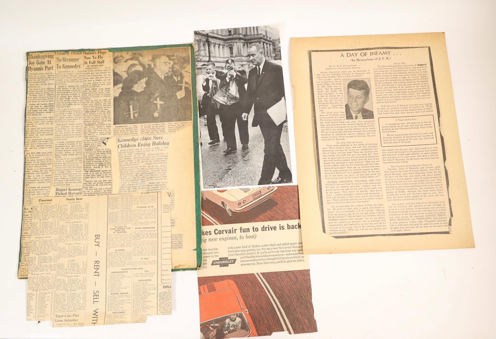 JFK Assassination Vintage Newspaper Clippings Lot: Collection of vintage newspaper clippings and photographs related to the assassination and funeral of President John F. Kennedy in 1963. The lot includes period articles, funeral imagery, and historic