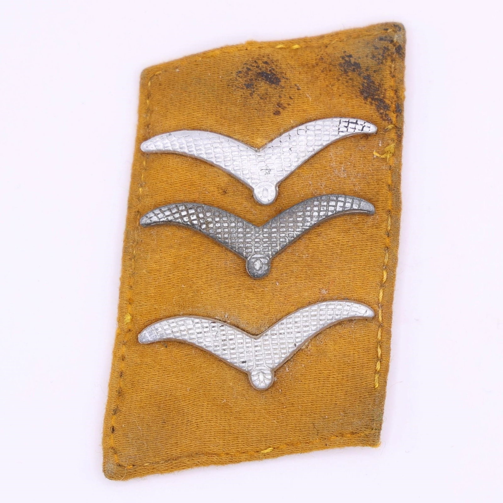 Luftwaffe Collar Tabs for Aircrew or Paratroopers: Luftwaffe collar tab for an Obergefreiter or Feldwebel of flying personnel or paratroopers, constructed of yellow felt with affixed metal rank device ("gull") denoting the wearer's rank.