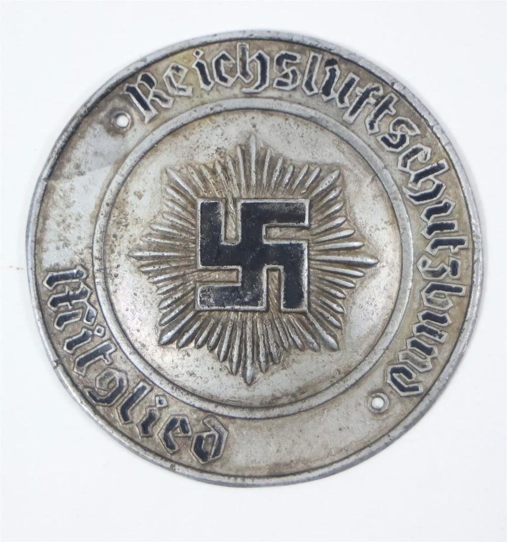 WWII German RLB Members Door ID Plaque: A WWII German RLB Members Door ID Plaque made of tombac, measuring approximately 73 mm in diameter. It features a raised outer ring with the inscription "Mitglied des Reichsluftschutzbundes - Landesgr