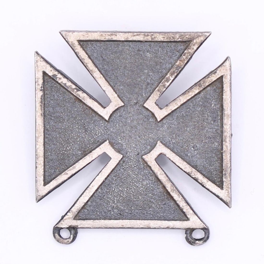 WWII US Army Marksman Qualification Badge: This is a US Army Marksman Qualification Badge. The badge is a white metal (silver, nickel, or rhodium) cross pattée, 1 inch in height. It is awarded to personnel upon successful completion of a weap