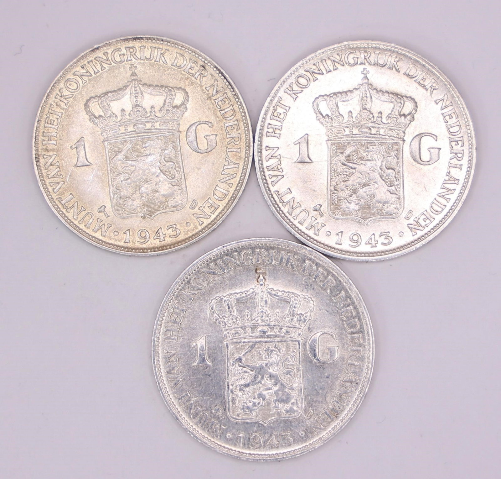 1943 Netherlands Queen Wilhelmina Silver Gulden: Three 1943 Netherlands silver 1 Gulden coin featuring Queen Wilhelmina, struck in .720 silver.