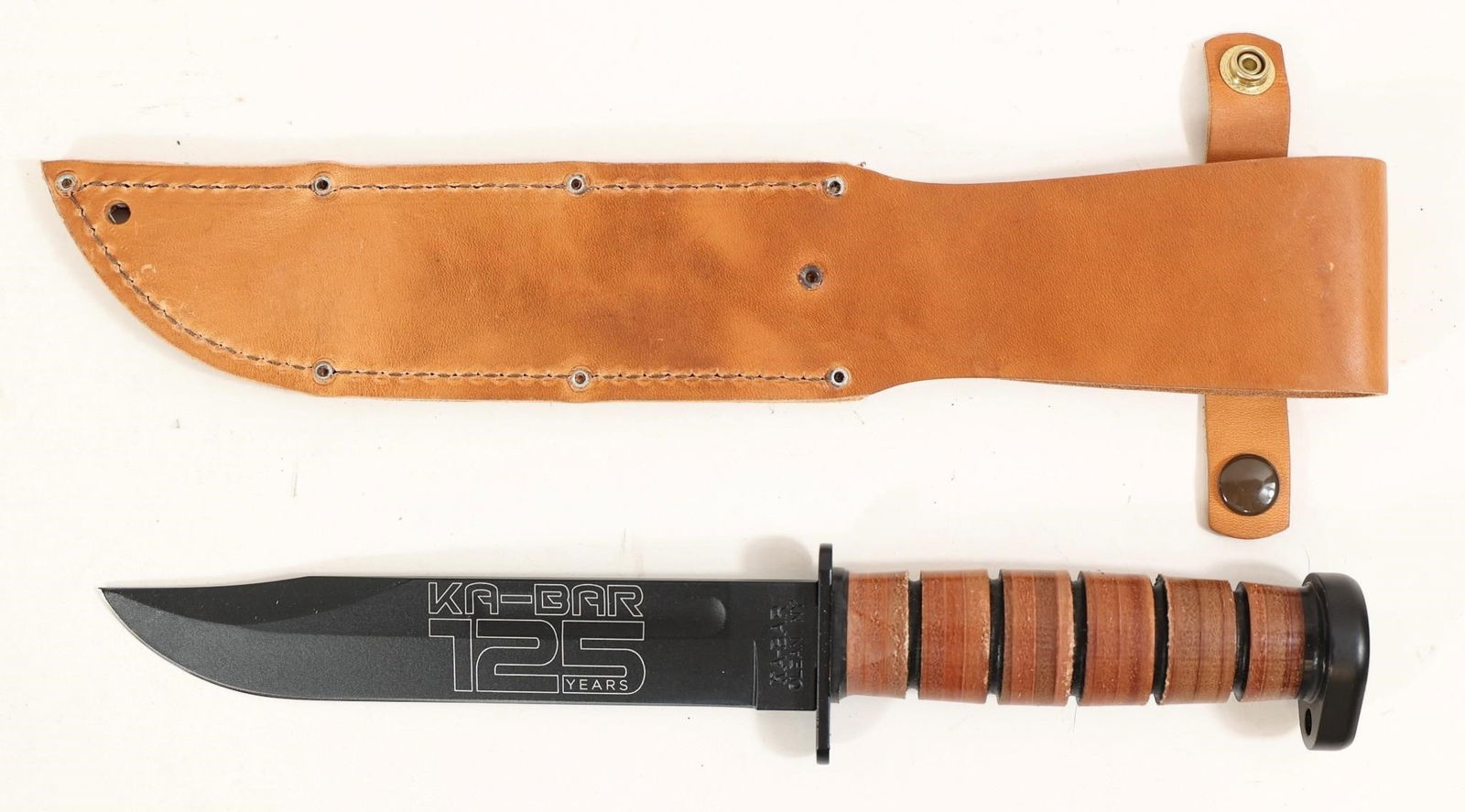 Ka-bar Dog's Head 125th Anniversary Knife: This Ka-bar Dog's Head 125th Anniversary Knife Is A Commemorative Fixed Blade That Balances Traditional Styling And Durable Construction. The Clip Point 7-inch 1095 Cro-van Blade Features A Flat