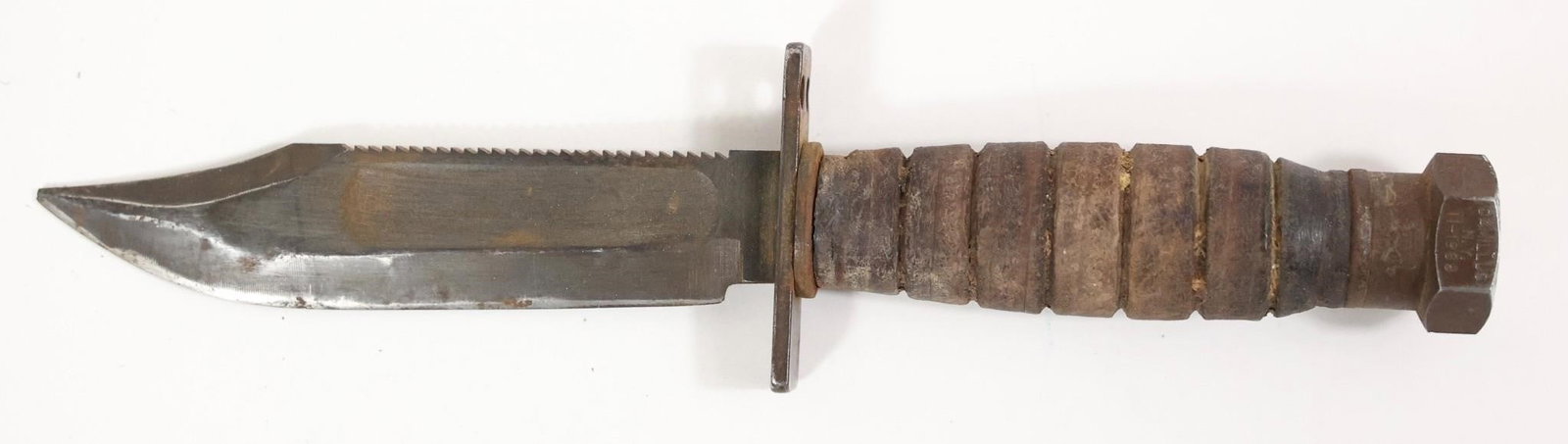 Vietnam War U.S. Air Force Pilot Survival Knife: Original Vietnam War-era U.S. Air Force pilot survival knife by Camillus, 5" blade dated April 1968, with correct leather sheath. Blade shows light service wear with much of the original finish