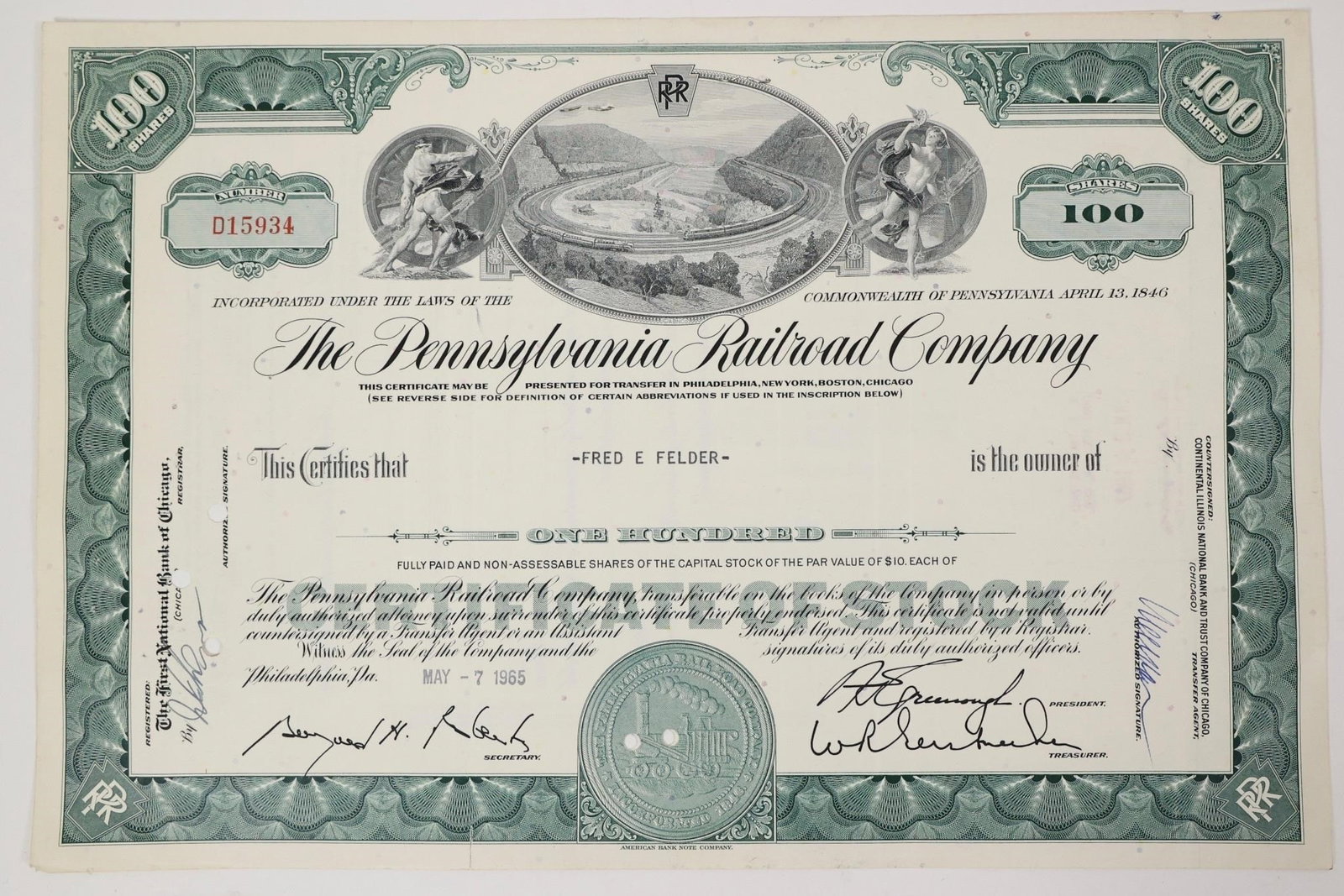 Pennsylvania Railroad Stock Certificate 1965: Pennsylvania Railroad Company stock certificate for 100 shares, issued on May 7, 1965. Green certificate featuring an engraved vignette of two trains traveling around the famous Horseshoe Curve in Pen