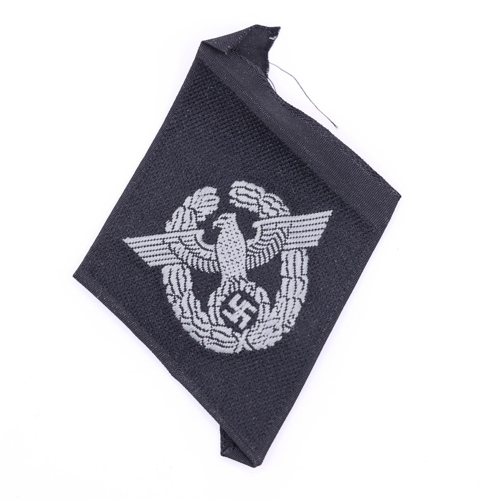 Waffen-SS Polizei Sleeve Diamond: Vertical woven black rayon diamond measuring approximately 65 × 45 mm, featuring a machine-woven police eagle surrounded by a vertically oval oak-leaf wreath in silvery-grey rayon threads. The