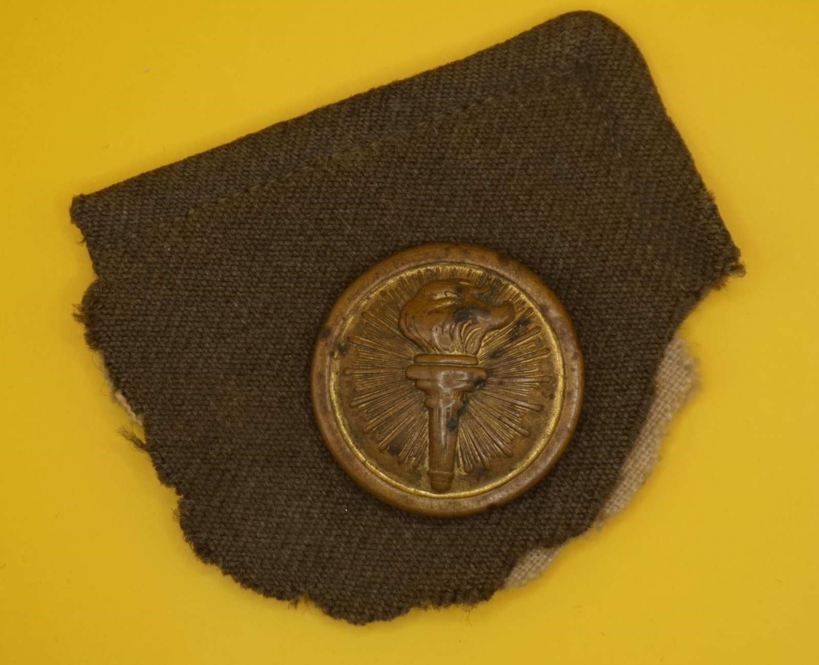 WWII Vintage US Army ROTC Collar Pin: This is a vintage US Army Reserve Officer Training Corps (ROTC) enlisted man's branch of service collar badge or pin, featuring the "torch of knowledge" insignia. The insignia depicts a flaming