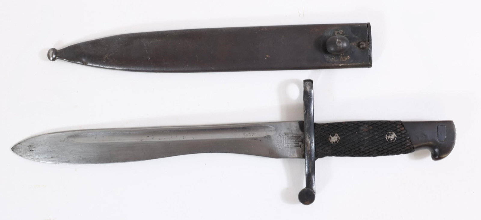 Spanish Military Bayonet w/ Scabbard: Spanish military bayonet with metal blade and handle, includes scabbard. Shows wear and age-related patina.Approx. OL: 14.5"BL: 10"